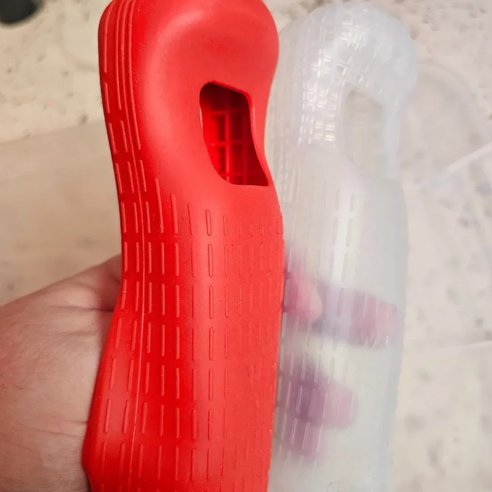2 Wii silicone controller cases, EUC condition, OEM Nintendo, 1 red, 1 clear
